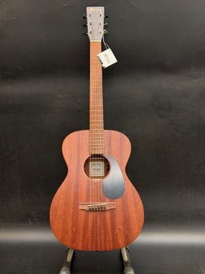 a wooden guitar on a stand with a tag on it
