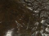 a close up picture of a bronze statue of a man