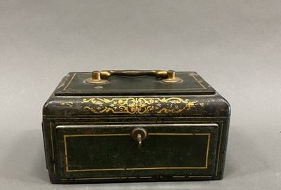 a small black box with gold trimming on it