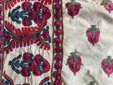 a close up of a piece of cloth with a design on it
