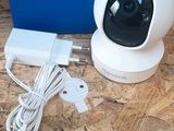a close up of a camera and a charger on a table