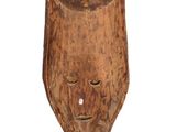 an old wooden mask on a white background with a white background