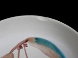 a white plate with a painting of a shrimp on it