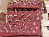 many figurines of people in a box on a table