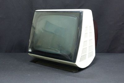 a small television sitting on top of a black table