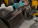a man that is working on a machine in the garage