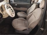 the interior of a small car with a steering wheel and a dashboard