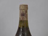 a bottle of wine that is sitting on a table