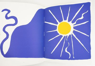 a book with a picture of a sun and a snake on it