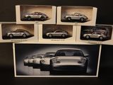 six different models of porsches in a box