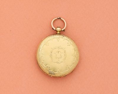 une image représentant une montre de poche en or sur fond rose