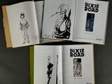 three pages of comics are spread out on a table