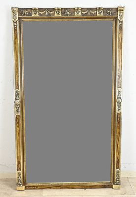 an image of a large gold framed mirror sitting on top of a wooden floor