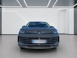 the front view of a grey volkswagen suv in a white room