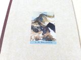 a picture of a book with a picture of a mountain on it