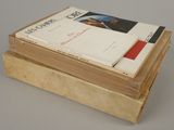 several books are stacked on top of each other on a table