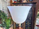 a lamp that is sitting on a table next to a mirror