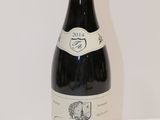 a bottle of wine that is sitting on a table