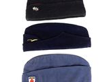 three hats are lined up on top of each other on a white surface