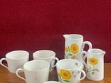 a lot of cups that are sitting on a table