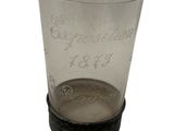 a shot glass with the name of a person on it