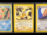 three different pokemon cards are displayed on a table