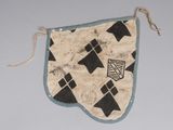 a small piece of cloth with black and white designs on it