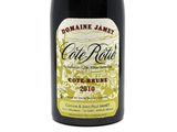 a bottle of wine that is sitting on a table