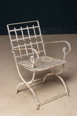 a metal chair that is sitting on the floor