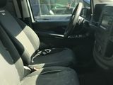 the interior of a car with the front seats folded down and the driver ' s seat folded down