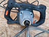 an image of a drill and a wire cutter on a wooden floor