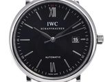a close up of a wrist watch with a black dial