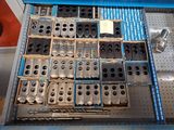 a drawer full of assorted metal parts in a store