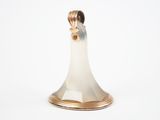 a close up of a silver and gold candle holder on a white background