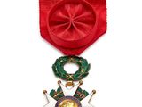 l'image d'un ruban rouge orné d'une étoile dorée