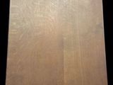 a picture of a cutting board on a black background