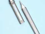 a close up of a pen and a pencil on a blue surface