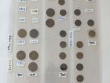 a lot of coins in a plastic bag on a table