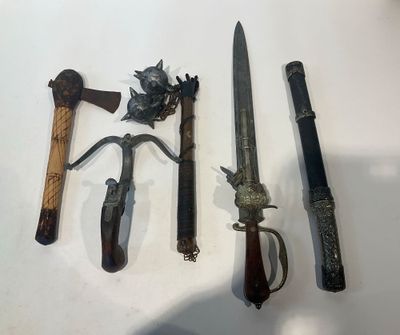 several different types of weapons are displayed on a white surface