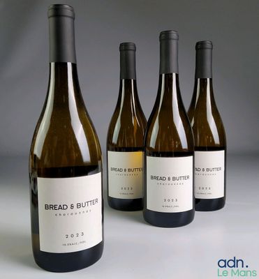 three bottles of bread and butter wine sitting next to each other