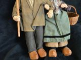 a couple of dolls that are standing next to each other