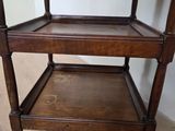 a wooden shelf with two shelves on top of it