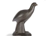 statue of a bird on a pedestal on a white background