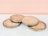 four coins sitting on top of each other on a table