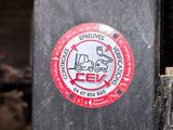 a sticker on the back of a skateboard with a picture of a car on it