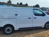 a white van that is parked on the side of the road