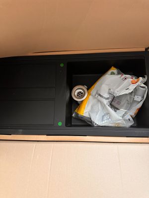 a box with a computer inside of it on the floor