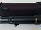 the camera lens is next to the case on the table
