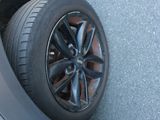 a tire that is sitting on the side of a car