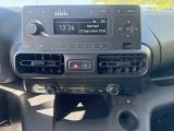 a car dashboard with a radio and other electronics in it
